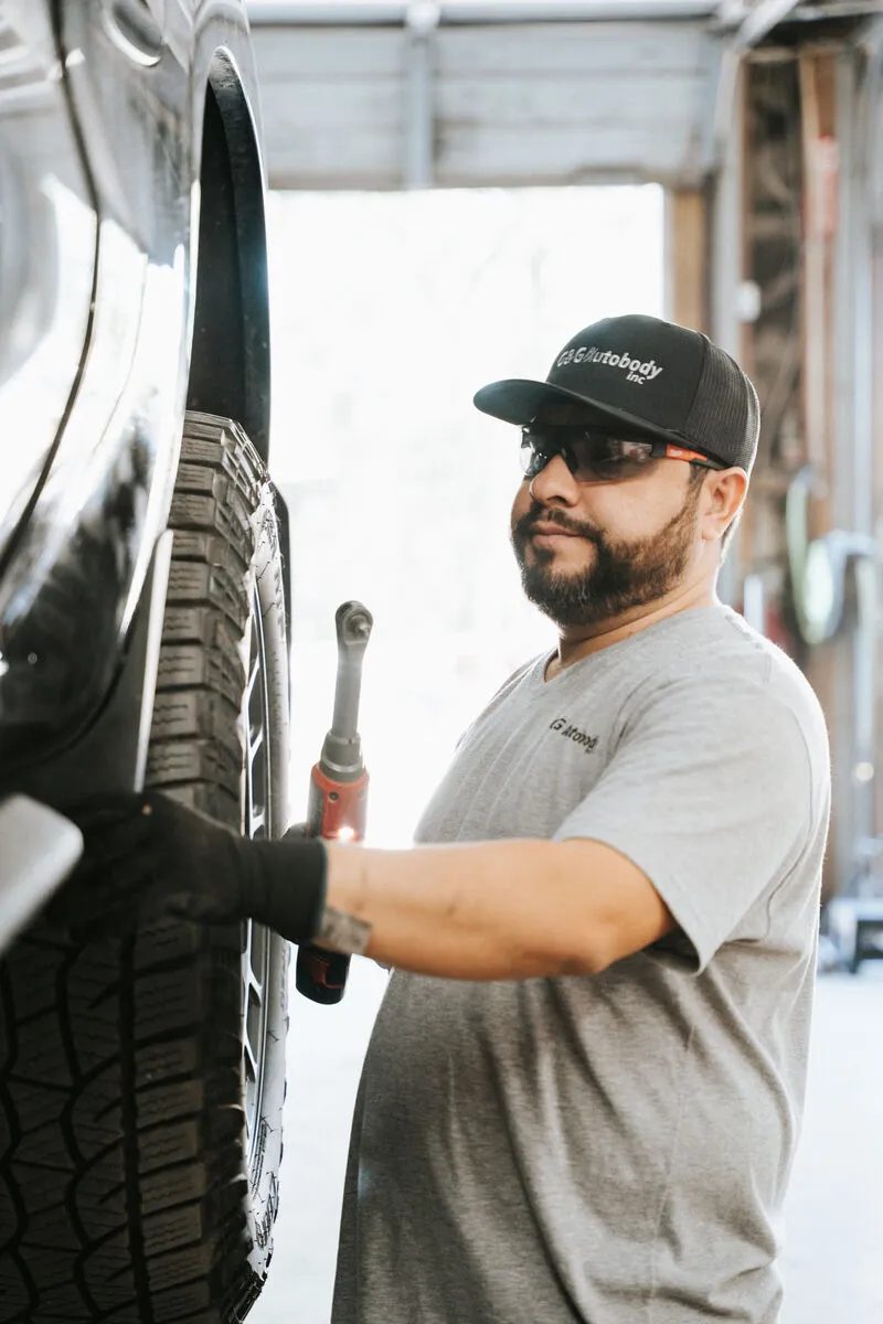 Skilled technician performing detailed body work